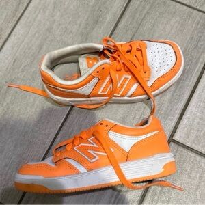 New Balance Kids' Vibrant Orange and White Sneakers